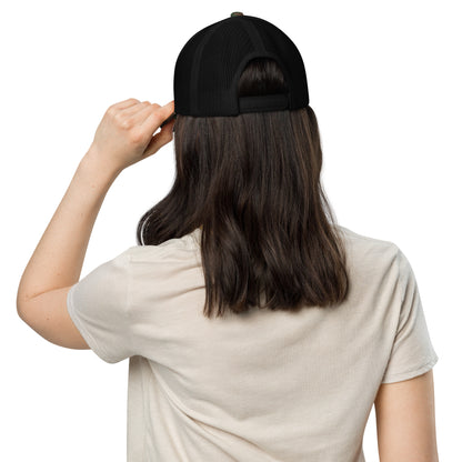 Red glitter lips design by Kirsten Blackburn embroidered on camouflage trucker hat with mesh back