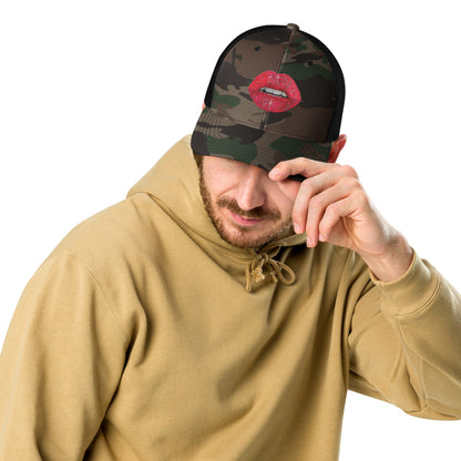 Red glitter lips design by Kirsten Blackburn embroidered on camouflage trucker hat with mesh back