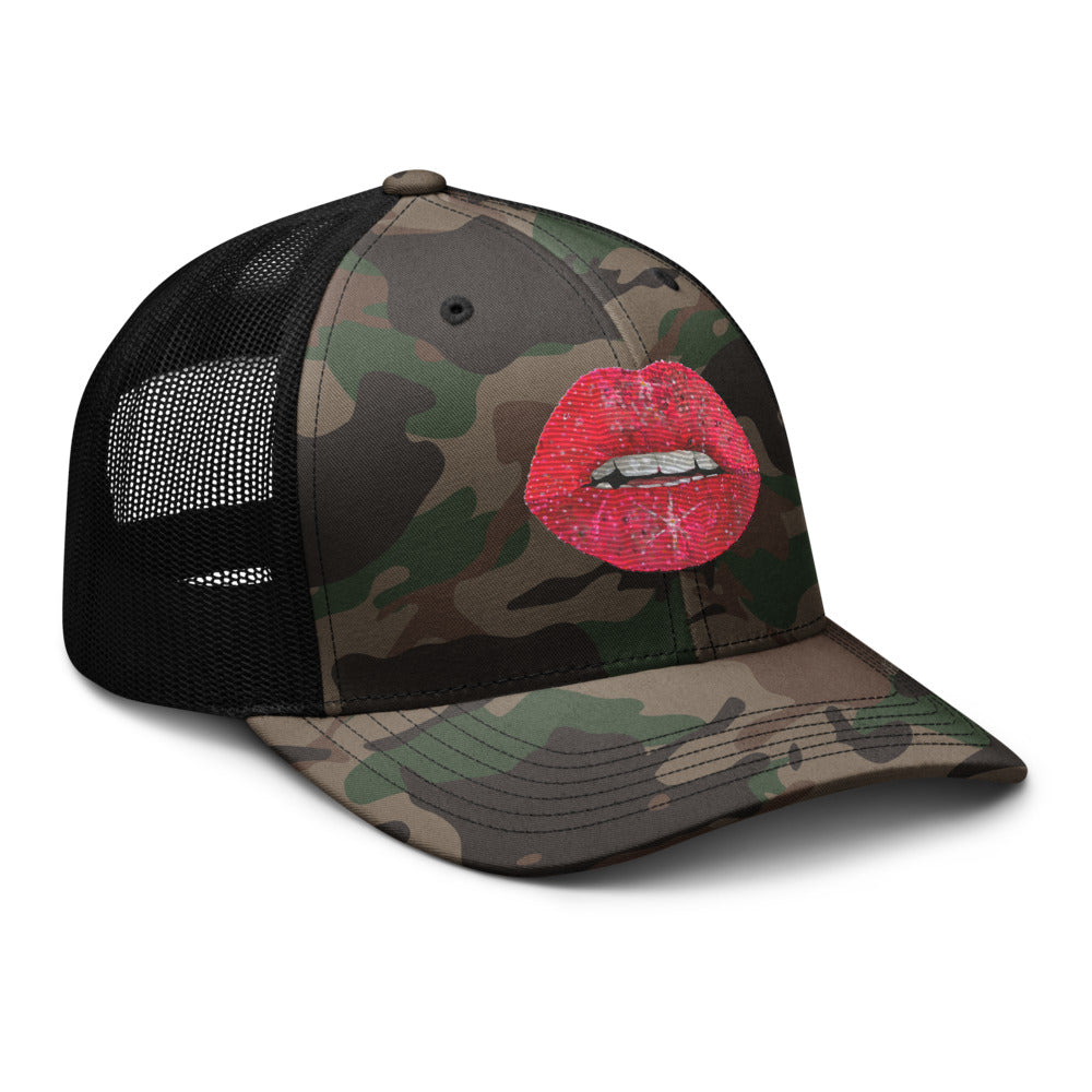 Red glitter lips design by Kirsten Blackburn embroidered on camouflage trucker hat with mesh back