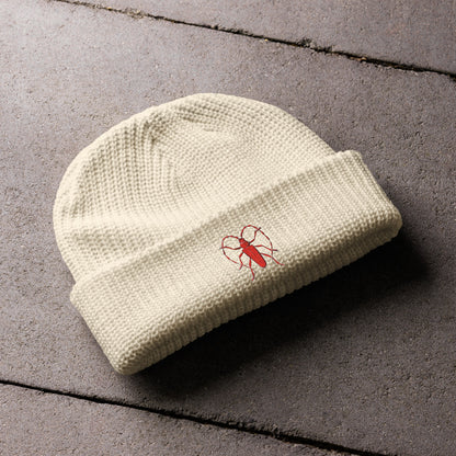 Red Beetle design by Kirsten Blackburn on fisherman beanie