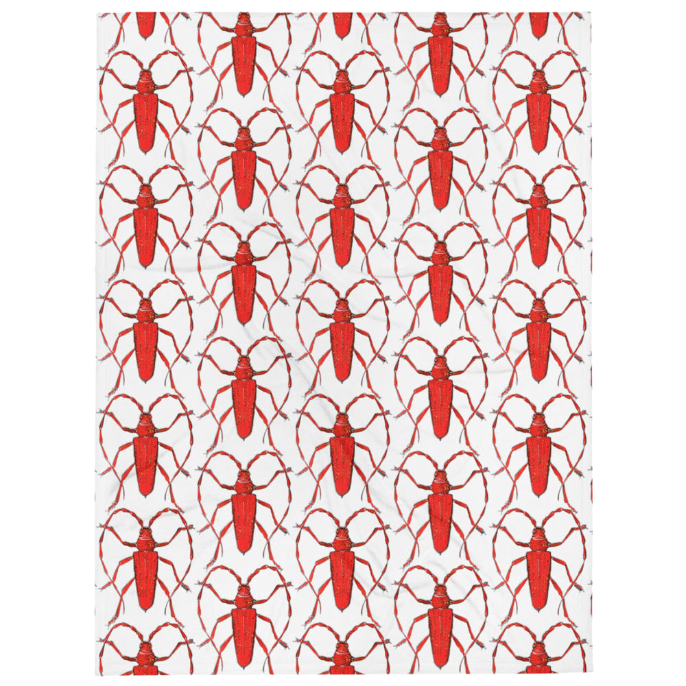Red beetle design by Kirsten Blackburn printed on soft throw blanket