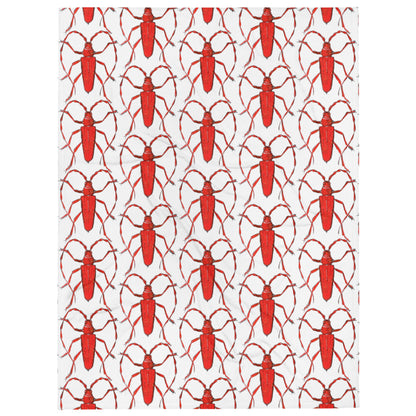 Red beetle design by Kirsten Blackburn printed on soft throw blanket
