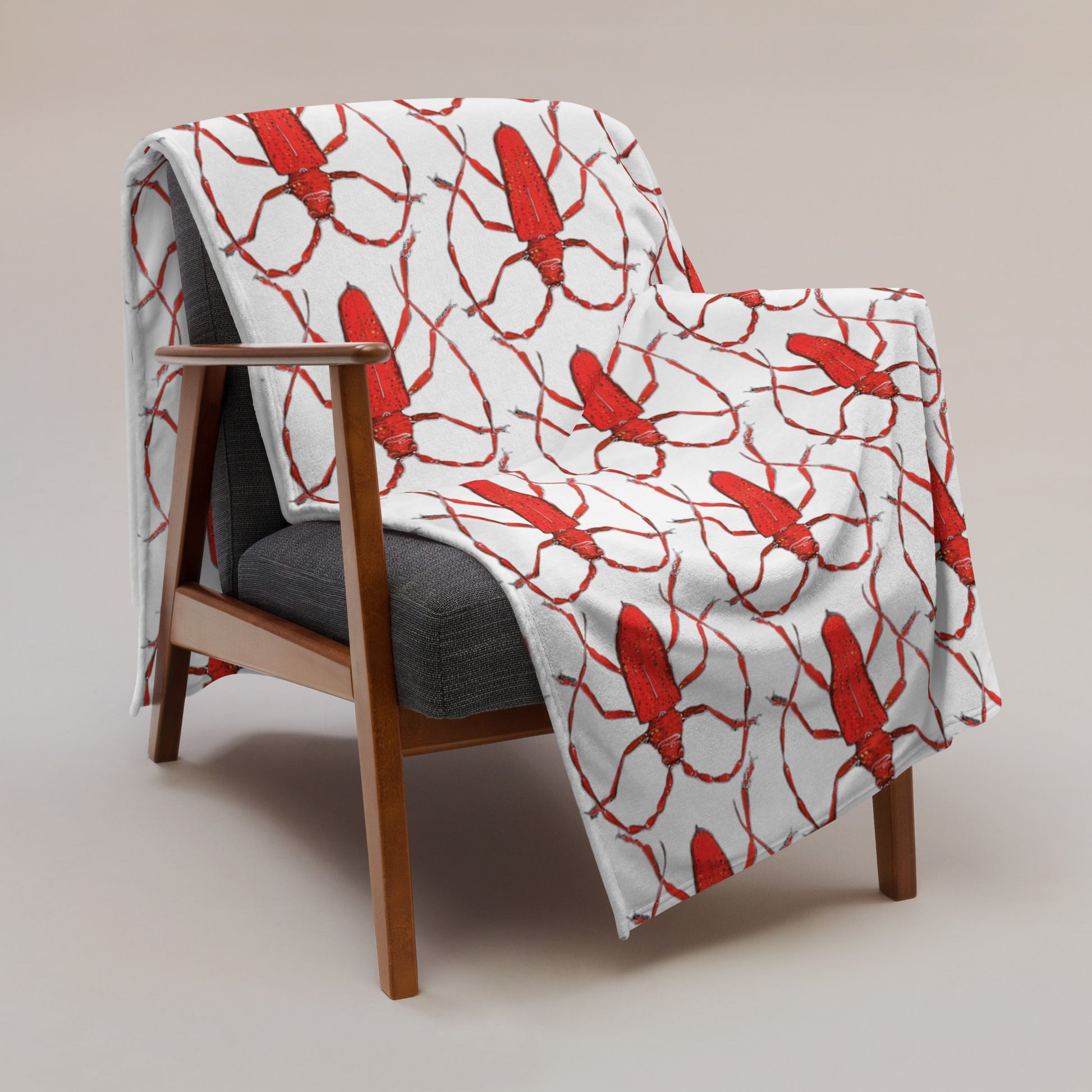 Red beetle design by Kirsten Blackburn printed on soft throw blanket